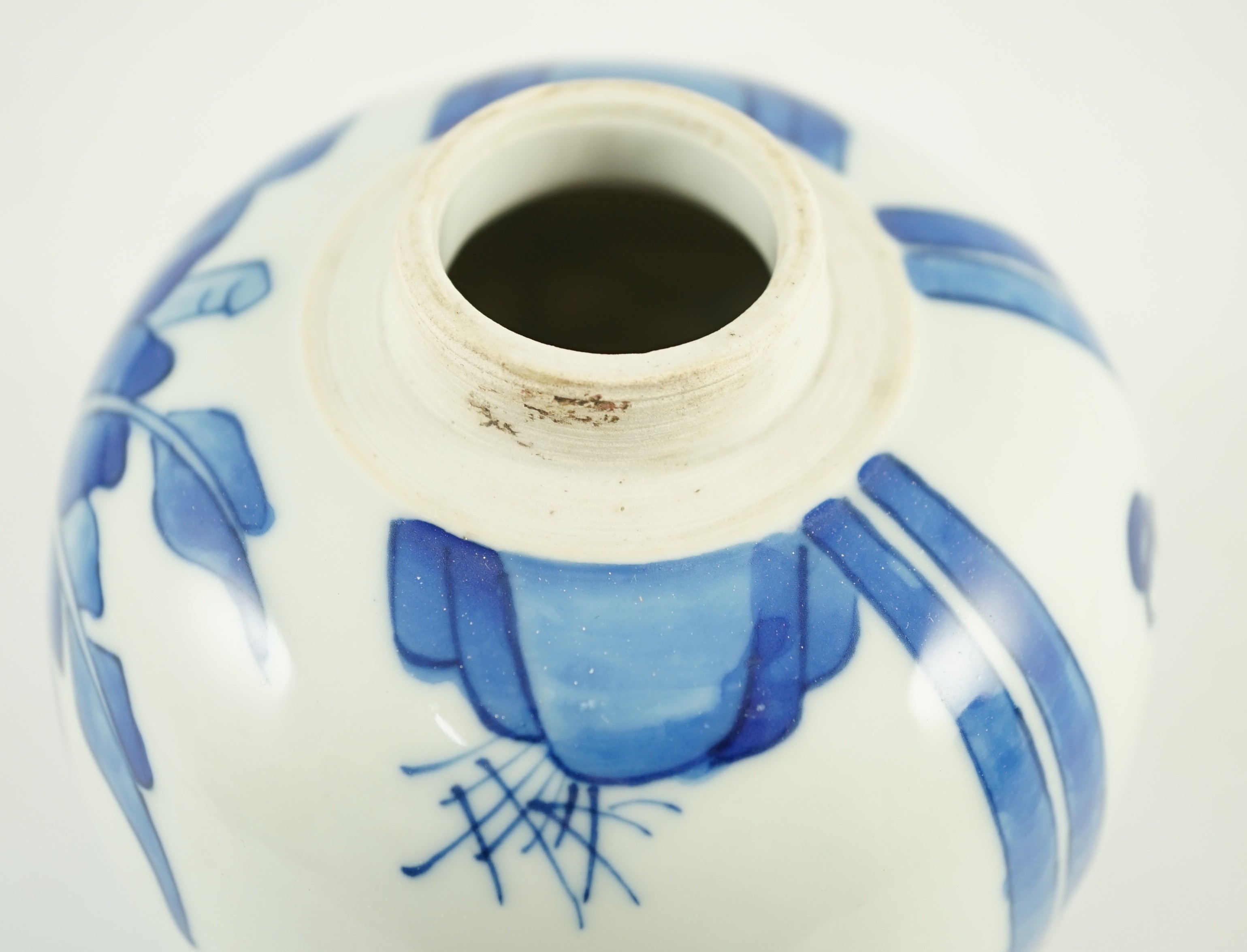 A Chinese blue and white jar and cover, probably Kangxi period, 15 cms high, 14.8cm high, small glaze losses to cover